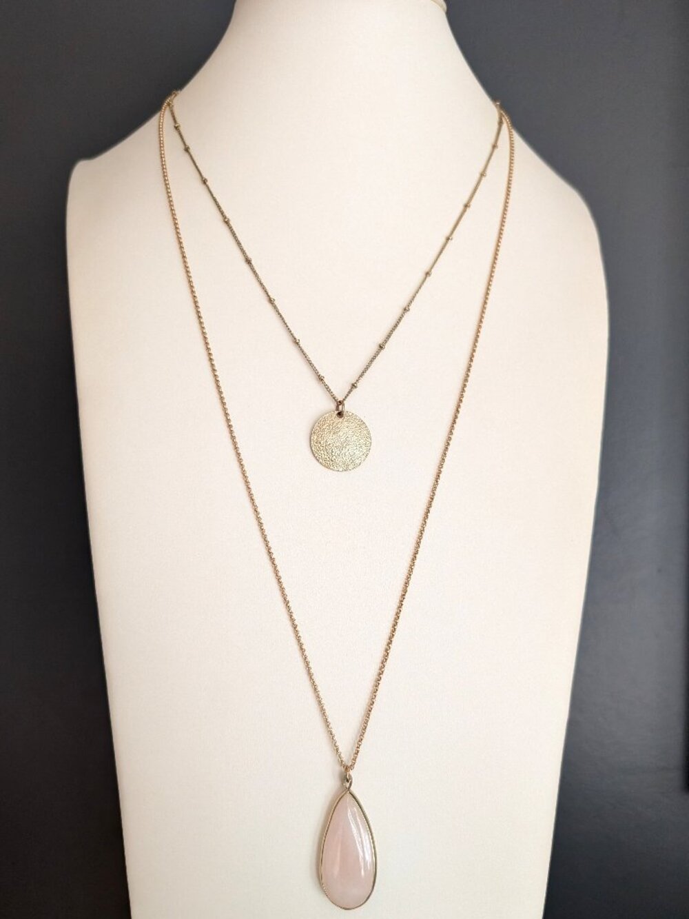 2 strand layered rose quartz and textured gold tone medallion necklace